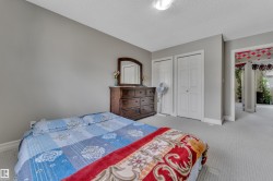 Carpeted room with neutral gray walls and white trim - 