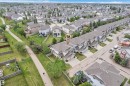 Aerial perspective of a developed residential area featuring multiple detached homes and townhouses - 24 655 Tamarck Road, Edmonton, AB 