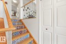 Staircase featuring wood treads and risers with decorative tile accents - 44 9630 176 Street, Edmonton, AB 