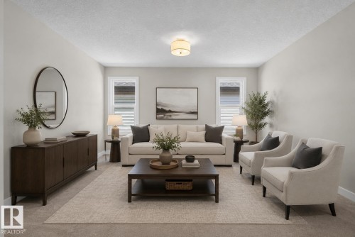 Spacious interior room featuring light-colored walls, recessed windows with horizontal blinds, and a textured ceiling - 9432 229 Street, Edmonton, AB 