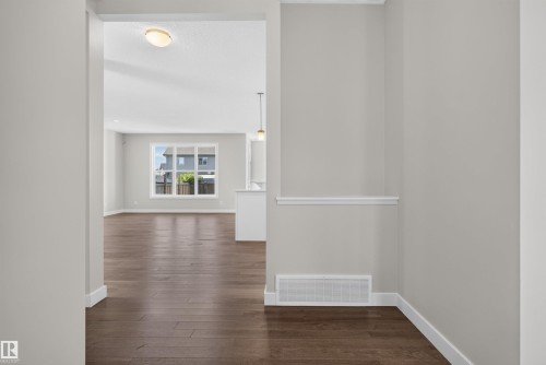 Spacious interior with rich wood-finish flooring extending throughout - 9432 229 Street, Edmonton, AB 