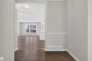 Spacious interior with rich wood-finish flooring extending throughout - 9432 229 Street, Edmonton, AB 