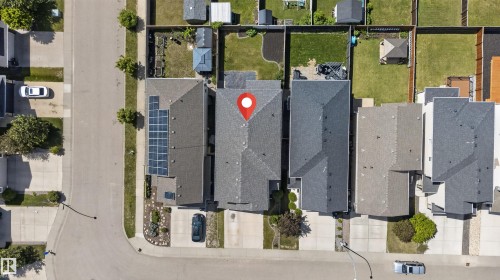 Aerial perspective of a residential street featuring shingled roofs and private backyards - 9432 229 Street, Edmonton, AB 