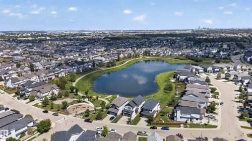 Extensive residential area with a prominent central pond surrounded by green space - 9432 229 Street, Edmonton, AB 