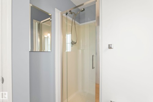 Shower enclosure with clear glass door and brushed nickel hardware - 7118 19A, Edmonton, AB - Indoor Photo Showing Bathroom