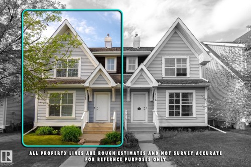 Two-story property featuring light-colored siding and white trim - 7118 19A, Edmonton, AB - Outdoor With Facade