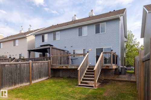 Rear exterior with light blue siding - 7118 19A, Edmonton, AB - Outdoor With Exterior