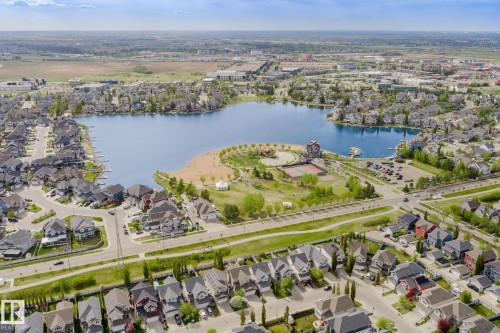Expansive lakeside community featuring numerous residential properties surrounding a prominent body of water - 7118 19A, Edmonton, AB - Outdoor With Body Of Water With View