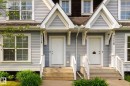 Exterior featuring light blue horizontal siding, white trim, and a shingle roof - 7118 19A, Edmonton, AB  - Outdoor With Facade 