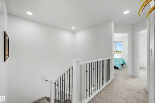 Open hallway with recessed lighting and neutral carpeting - 3173 Checknita Way, Edmonton, AB 
