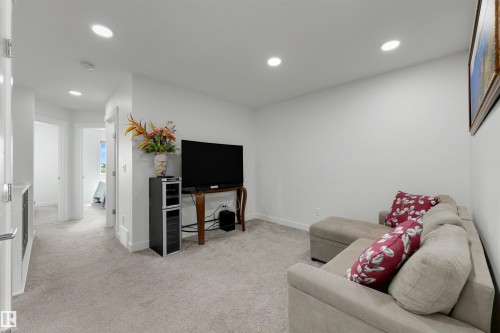 Carpeted interior space featuring white walls and recessed lighting - 3173 Checknita Way, Edmonton, AB 