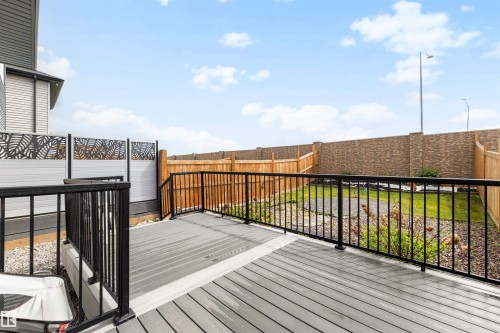 Spacious composite deck with black metal railings - 3173 Checknita Way, Edmonton, AB 