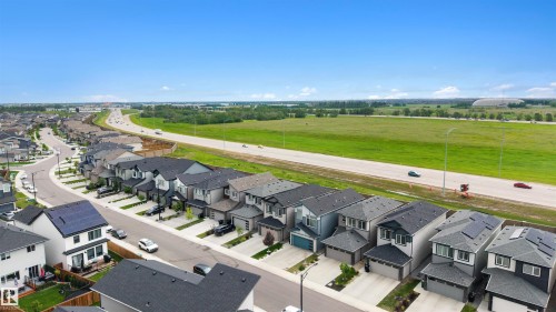Modern residential community featuring multi-story homes with attached garages - 3173 Checknita Way, Edmonton, AB 