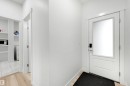 Entryway featuring a white door with frosted glass panel and smart lock hardware - 3173 Checknita Way, Edmonton, AB 