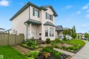 Two-story residence featuring light-colored siding and a contrasting dark roof - 3117 32 Avenue, Edmonton, AB 