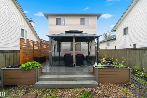 Rear exterior featuring a multi-tiered deck with a gazebo - 3117 32 Avenue, Edmonton, AB 