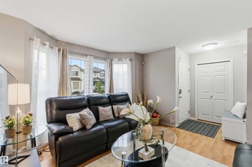 Entryway features wood-finish flooring and a white paneled door - 3117 32 Avenue, Edmonton, AB 