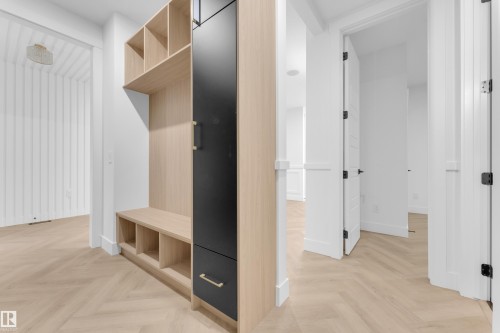 Built-in wood-finish shelving unit with integrated bench seating - 7677 Kimiwan Crescent, Edmonton, AB 