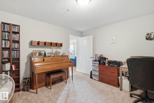 Wall-to-wall carpeting in a neutral tone and light-colored walls - 1223 9363 Simpson Dr, Edmonton, AB 