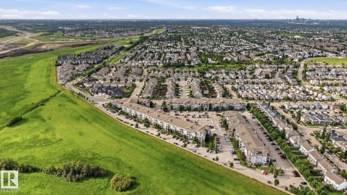Expansive suburban development featuring a mix of single-family residences and multi-story apartment buildings - 1223 9363 Simpson Dr, Edmonton, AB 