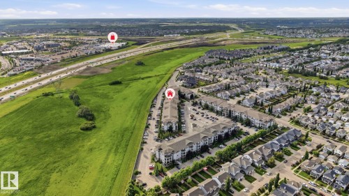 Expansive aerial showcasing a residential community with varied architectural styles - 1223 9363 Simpson Dr, Edmonton, AB 