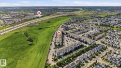 Expansive aerial showcasing a residential community with varied architectural styles - 