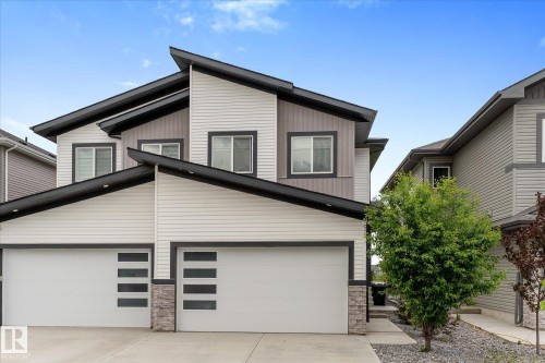 Modern exterior featuring multi-toned siding, stone accents, and a distinctive roofline - 92 Elm Street, Fort Saskatchewan, AB 