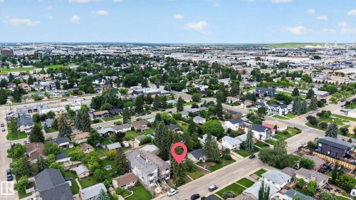 Residential neighborhood with mature trees and a mix of single-family homes and multi-unit properties - 10924 154 Street, Edmonton, AB 