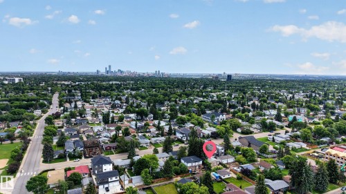 Aerial perspective showcasing a residential neighborhood with a distant urban skyline - 10924 154 Street, Edmonton, AB 