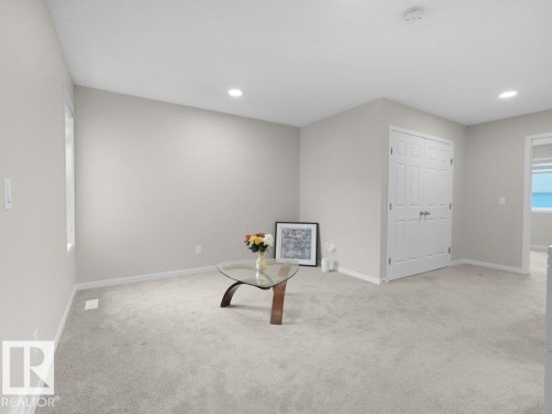 Neutral wall paint and light-toned carpeting create a bright interior - 2039 13 Avenue, Edmonton, AB 