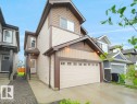 Contemporary two-story residence featuring light-toned siding and dark brown trim accents - 2039 13 Avenue, Edmonton, AB 