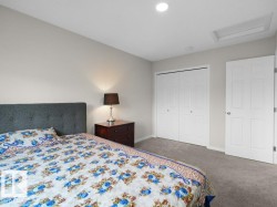 Neutral tone walls complement the light gray carpeting - 