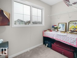 Double-pane window with white frame, light gray walls, and gray carpet - 