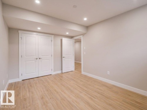 Neutral paint tones complementing wood-finish flooring - 2039 13 Avenue, Edmonton, AB 