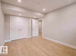 Neutral paint tones complementing wood-finish flooring - 