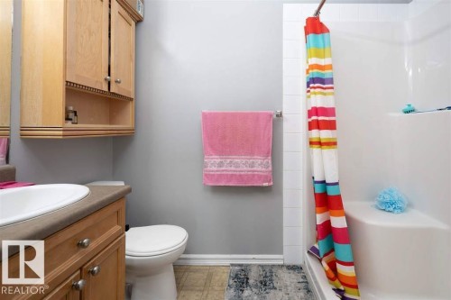 Bathroom featuring a vanity with an integrated sink and countertop - #117 226 Macewan Sw, Edmonton, AB - Indoor Photo Showing Bathroom