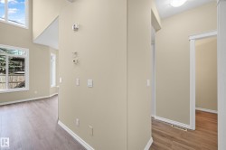 Vaulted ceilings and abundant natural light from multiple windows - 