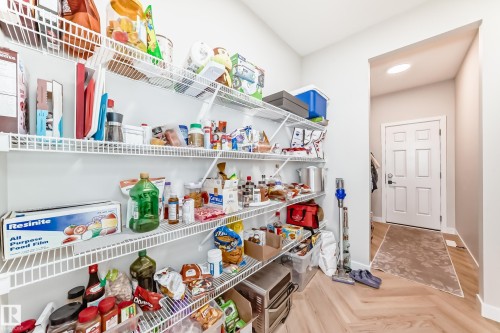 Walk-in pantry featuring multiple levels of wire shelving - 4231 206 Street, Edmonton, AB 