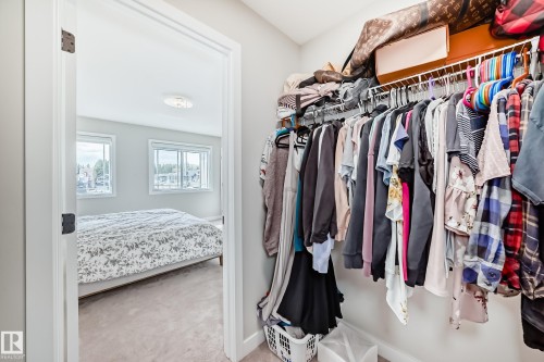 Integrated closet system featuring wire shelving and hanging rods - 4231 206 Street, Edmonton, AB 