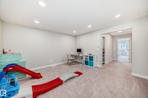 Spacious room with light neutral wall paint and recessed ceiling lights - 4231 206 Street, Edmonton, AB 