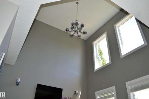 Vaulted ceiling with an architectural chandelier - 1 Hemlock Close, Fort Saskatchewan, AB 
