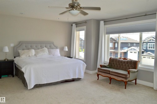Expansive room featuring light neutral wall paint, recessed lighting, and a ceiling fan - 1 Hemlock Close, Fort Saskatchewan, AB 