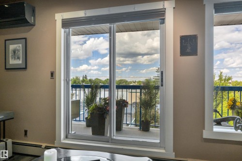 Sliding glass door leading to an outdoor balcony - 305 5212 48 Avenue, Wetaskiwin, AB 