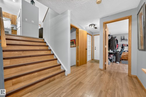 Wood-finish flooring throughout the entryway and stairs - 1 Primrose Boulevard, Sherwood Park, AB 