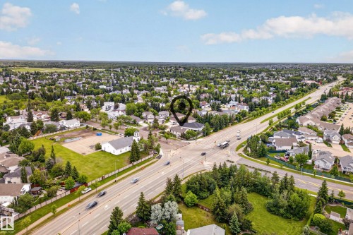 Aerial perspective showcasing a residential area with extensive tree coverage - 1 Primrose Boulevard, Sherwood Park, AB 