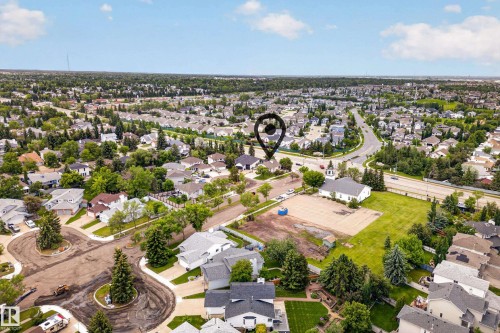 Aerial perspective of a residential neighborhood with established homes and mature trees - 1 Primrose Boulevard, Sherwood Park, AB 