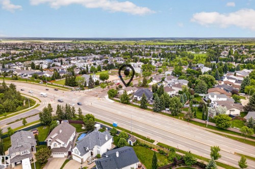 Aerial perspective showcasing a developed residential area with mature tree landscaping - 1 Primrose Boulevard, Sherwood Park, AB 