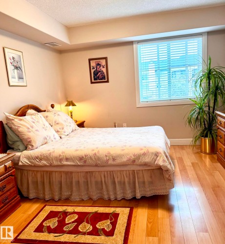 Spacious primary bedroom with walk through closet and ensuite. - 330 13111 140 Avenue, Edmonton, AB 