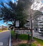 Palisades Park Villas entrance sign with address information - 330 13111 140 Avenue, Edmonton, AB 
