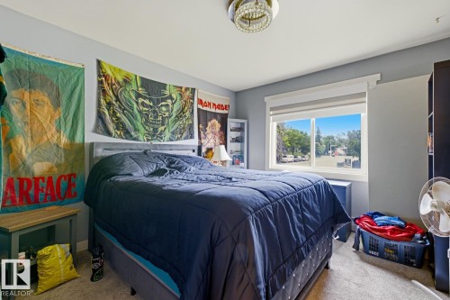 Room featuring carpeting and a neutral wall color - 15 10164 150 Street, Edmonton, AB 